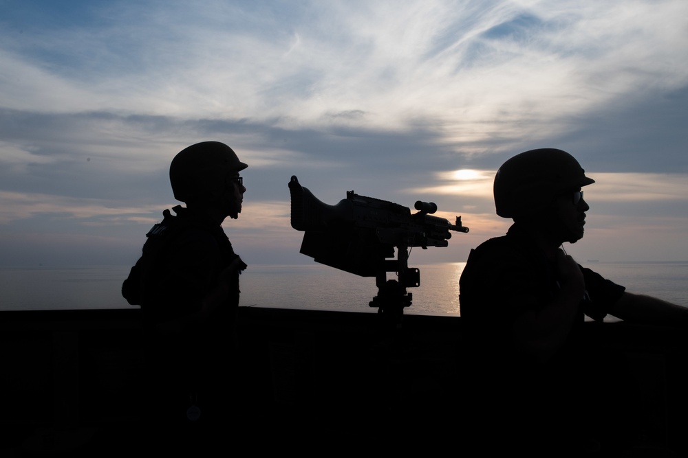 U.S. Navy Boatswain’s Mate Seaman Aaron Shambaugh, left, from Lancaster, Pennsylvania, and Quartermaster 2nd Class Joel Prentice, from Edmond, Oklahoma