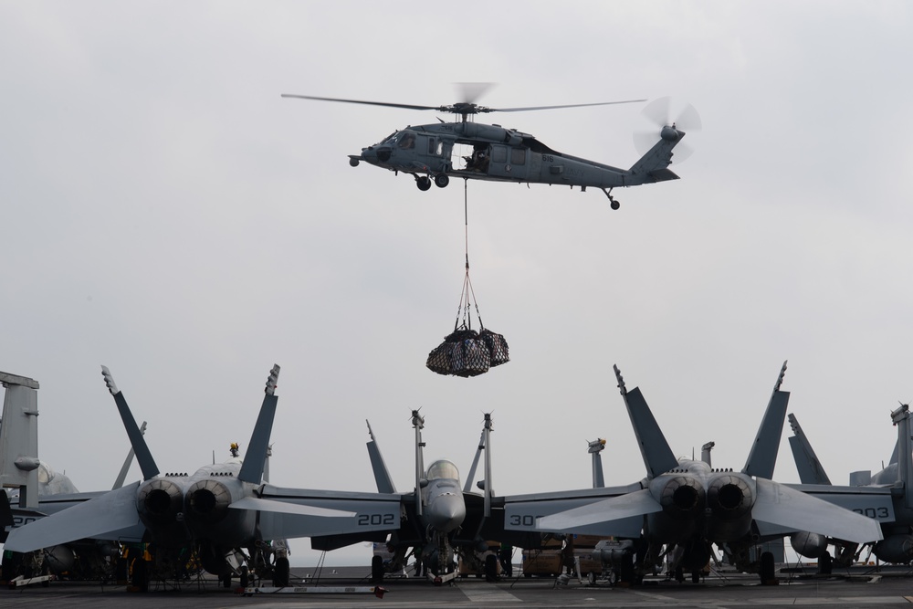 The aircraft carrier USS John C. Stennis (CVN 74) conducts vertical replenishment
