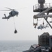 The aircraft carrier USS John C. Stennis (CVN 74) conducts vertical replenishment