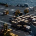 U.S. Sailors handle cargo