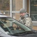 102nd Security Forces Squadron defender checks personnel identification on Joint Base Cape Cod