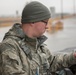 102nd Security Forces Squadron defender checks personnel identification on Joint Base Cape Cod