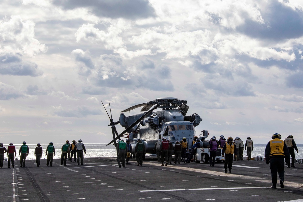 Sailors and Marines conduct a FOD walkdown
