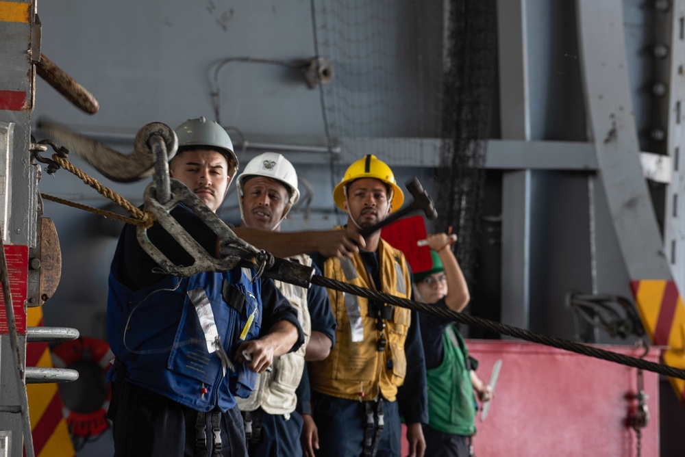 U.S. Sailor trips the pelican wire aboard the aircraft carrier USS John C. Stennis (CVN 74)