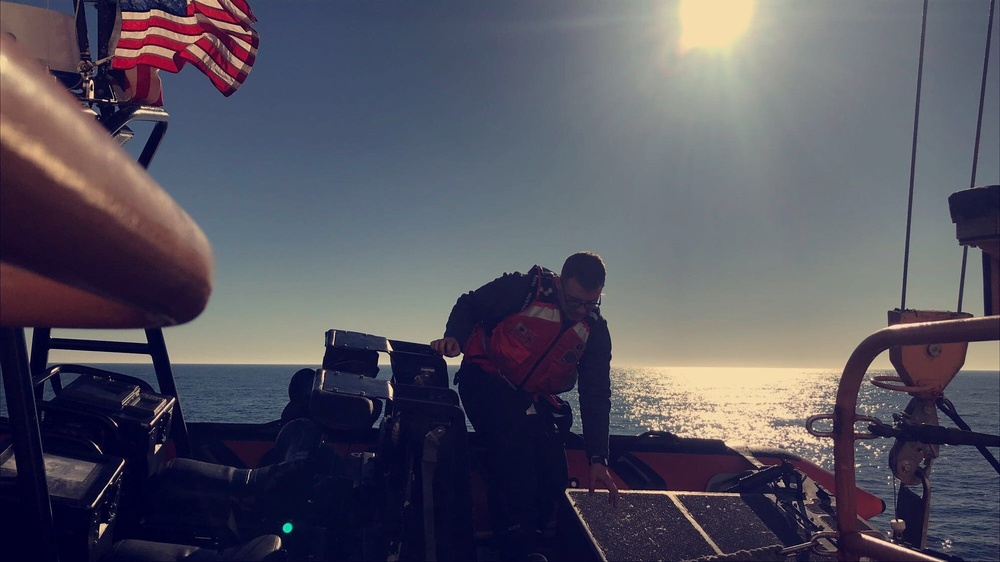 Coast Guard Cutter Mellon crew performs small boat maintenance while underway in Bering Sea