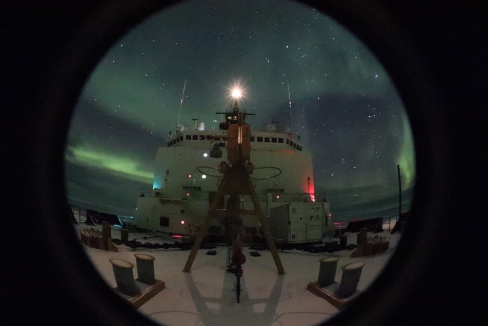 Northern lights visible over the Coast Guard Cutter Healy during Arctic West Summer 2018