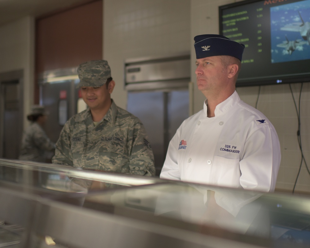 Always an Airman: Leadership serves first lunch at dining facility