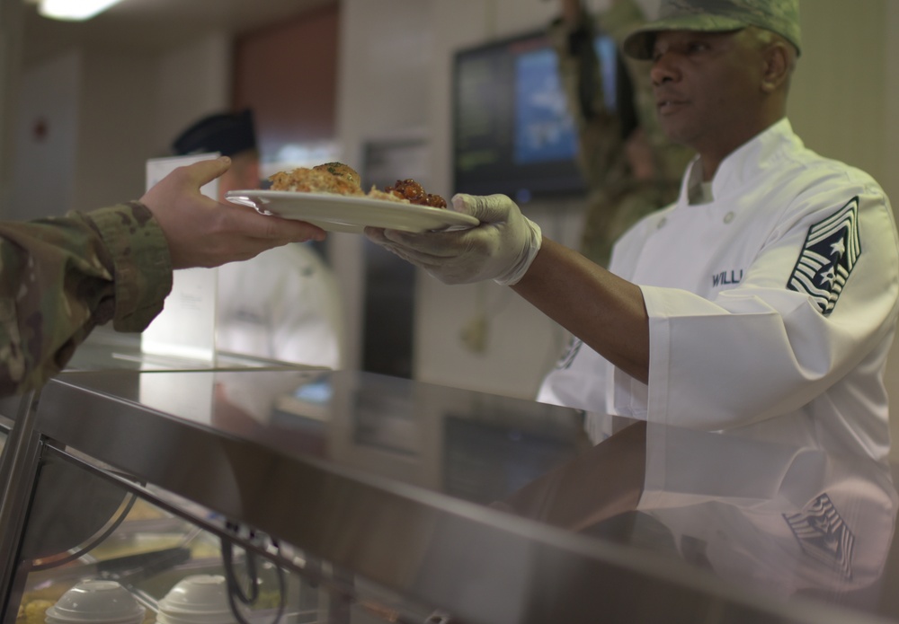 Always an Airman: Leadership serves first lunch at dining facility