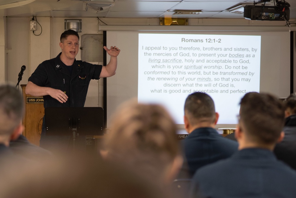 U.S. Navy Chaplain preaches aboard the aircraft carrier USS John C. Stennis (CVN 74)