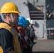 U.S. Navy Electronics Technician 2nd Class William Glynn, from Norwood, Massachusetts, stands in formation aboard USS Chung-Hoon