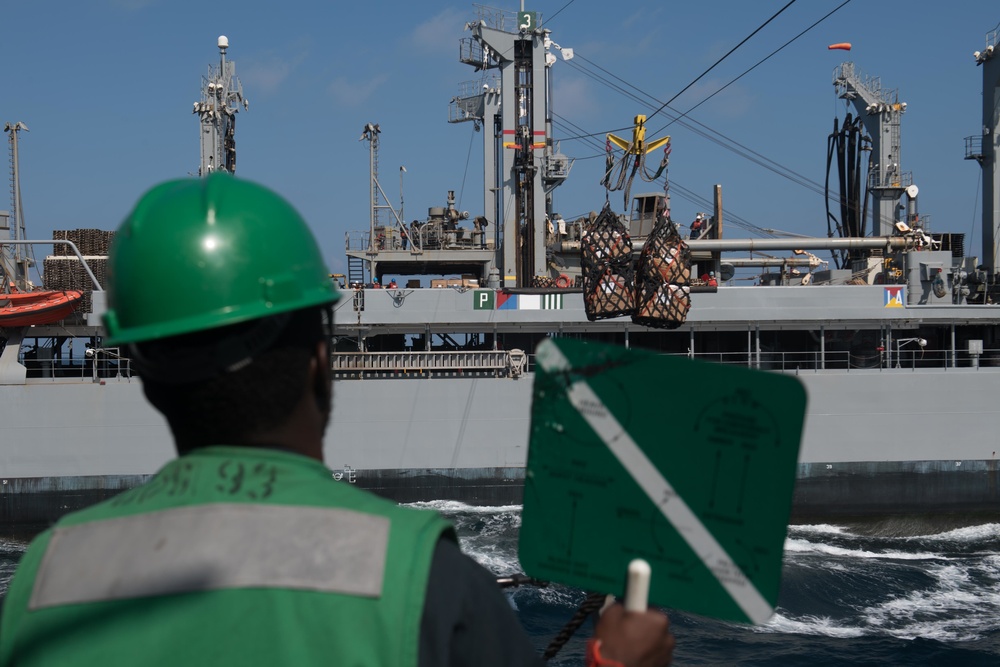 U.S. Navy Seaman Aman Pace, from Orangeburg, South Carolina, signals from USS Chung-Hoon