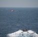 U.S. Sailors assigned to USS Chung-Hoon (DDG 93) transit toward a dhow in the Gulf of Aden