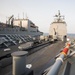 The guided-missile cruiser USS Mobile Bay (CG 53) conducts a vertical replenishment