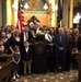 Chief Warrant Officer 2 Tom Barrett and his family following his swearing in as a Michigan Senator