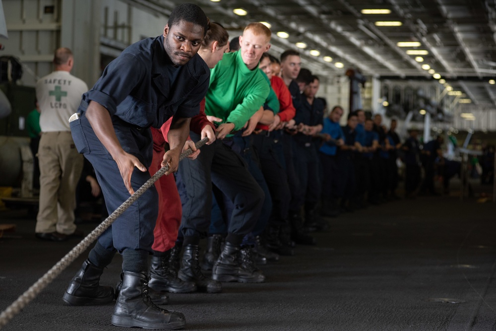 U.S. Sailors heave line