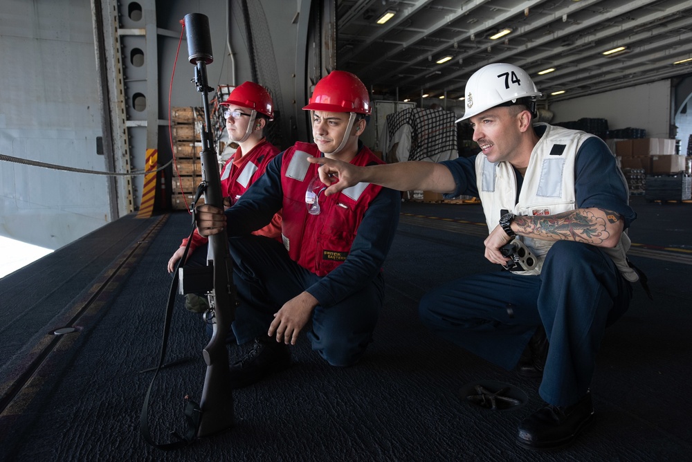 U.S. Sailors assses the distance to the dry cargo and ammunitions ship USNS Charles Drew (T-AKE 10)