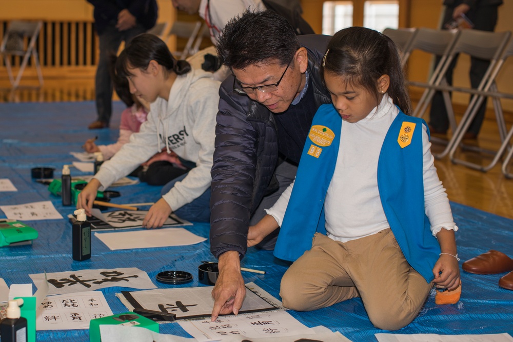 Girl Scouts write in the new year with Kakizome