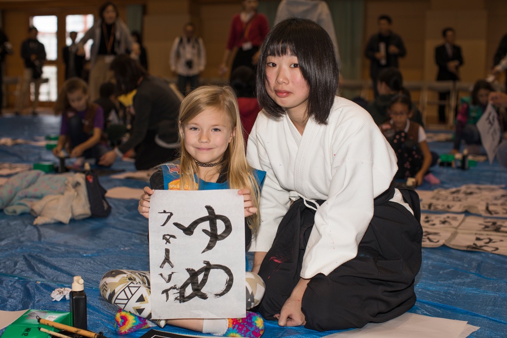 Girl Scouts write in the new year with Kakizome