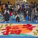 Girl Scouts write in the new year with Kakizome