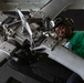 U.S. Sailor cleans paddles of an MH-60R Sea Hawk