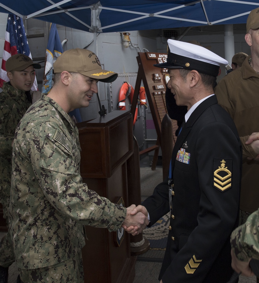 USS Antietam (CG 54) Executive Officer welcomes JMSDF Sailors during 7th Fleet Sailor of the Year competition