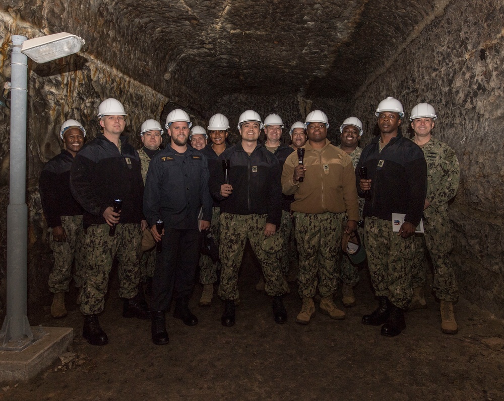 Sailors pause for a group photo as part of a  cave tour during the Sailor of the Year competition at Fleet Activites Yokosuka.