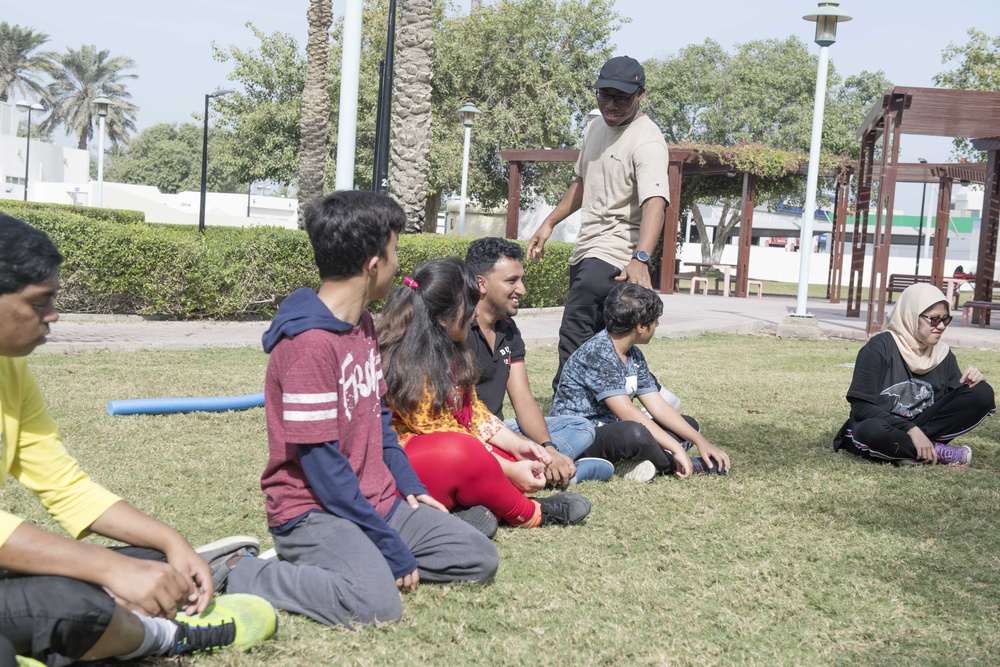 U.S. Sailors from USS Spruance interact with students at Tender Hearts Arena, Dubai, UAE