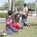 U.S. Sailors from USS Spruance interact with students at Tender Hearts Arena, Dubai, UAE