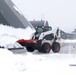 Truck pushes snow out the way for clearance to the hardened aircraft shelter