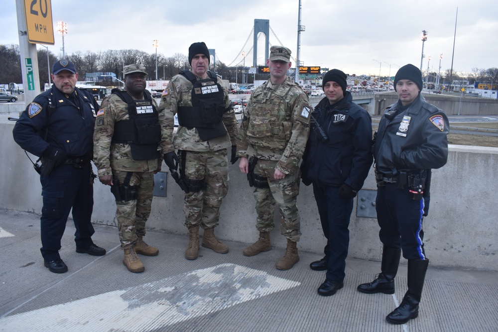 New York National Guard Soldier with Joint Task Force-Empire Shield conduct joint operations with local law enforcement