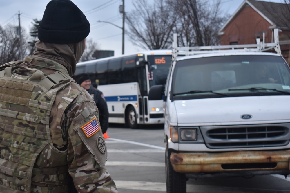 New York National Guard Soldier with Joint Task Force-Empire Shield conduct joint operations with local law enforcement