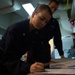U.S. Sailor signs legal instruction