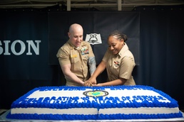 U.S. Sailors cut cake  during a Religious Programs Specialist 40th birthday celebration
