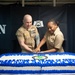 U.S. Sailors cut cake  during a Religious Programs Specialist 40th birthday celebration