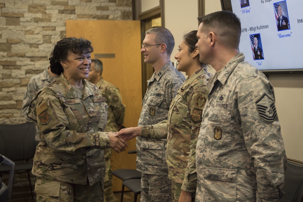 Inspector General of the Air Force Lt. Gen. Stayce Harris congratulates members of the 149th IG office