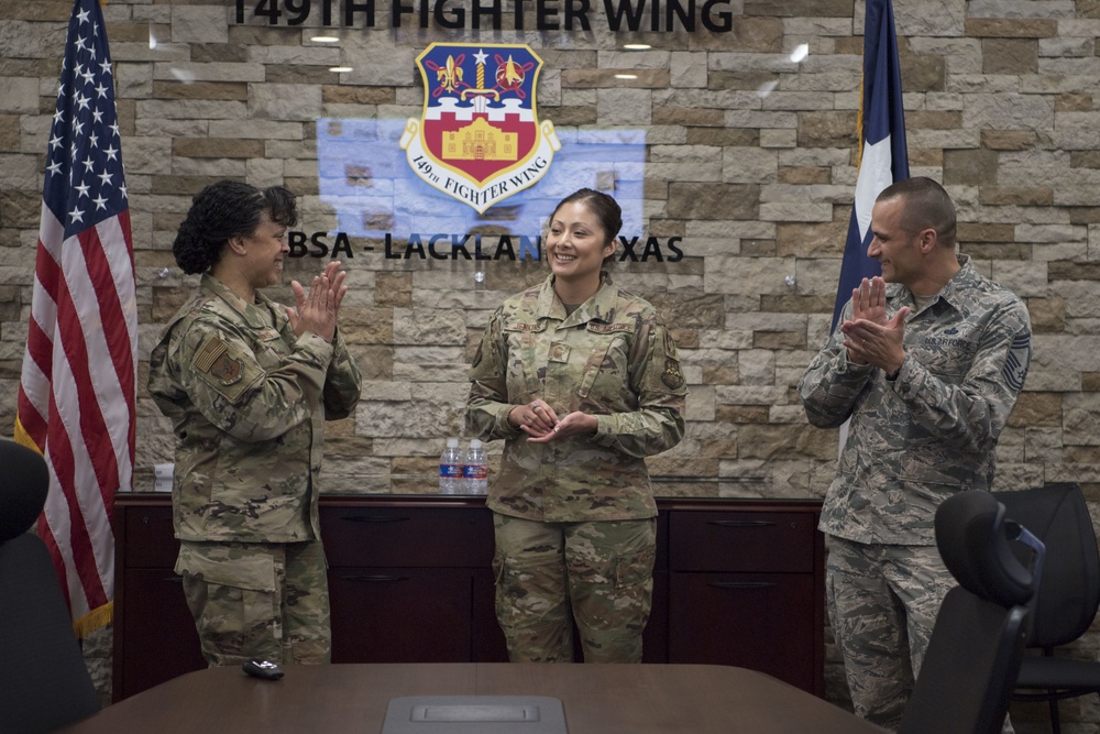 Inspector General of the Air Force Lt. Gen. Stayce Harris congratulates members of the 149th IG office