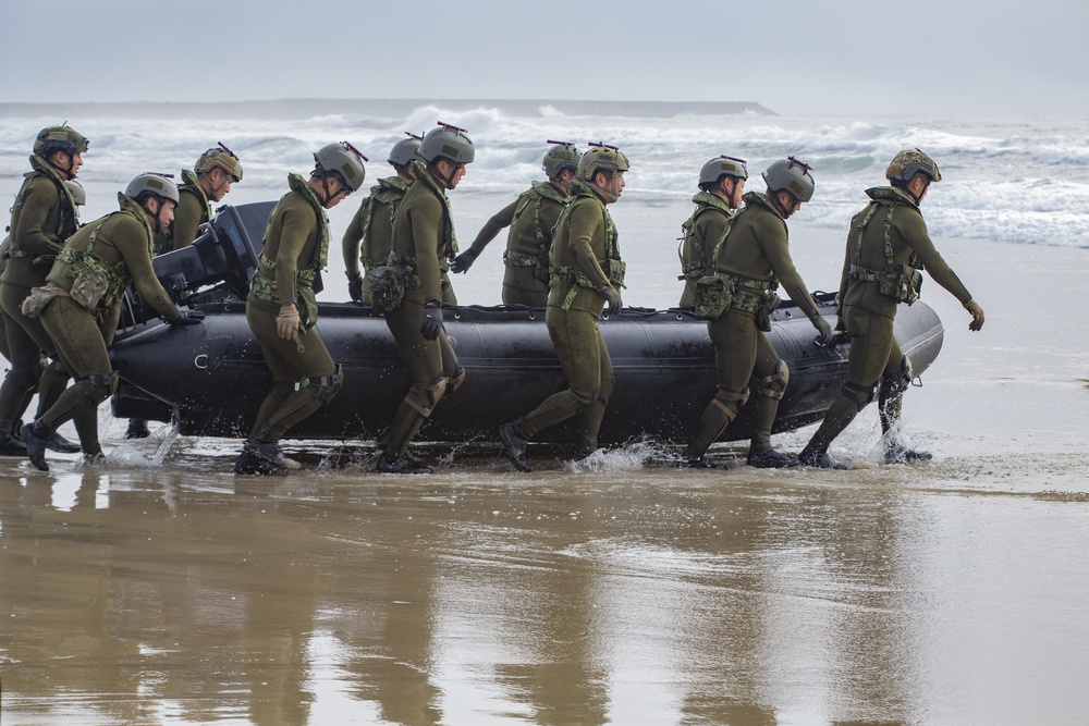 U.S. Marines and Japanese Ground Self-Defense Force Soldiers use combat rubber raiding crafts for surf passage during Iron Fist