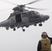 U.S. Navy Boatswain’s Mate 3rd Class Brandon Ross, from Honeapath, South Carolina, salutes the pilot of a Panther anti-submarine helicopter