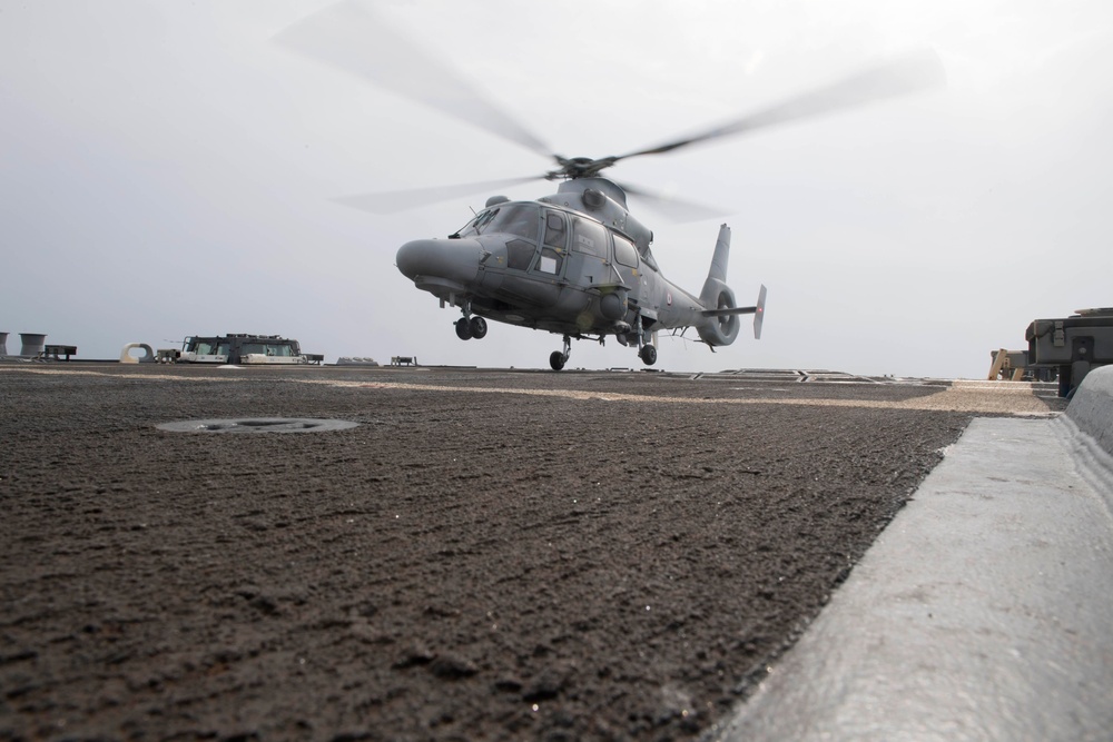 A Panther anti-submarine helicopter, assigned to France’s Marine Nationale air defense destroyer FS Cassard (D 614), lands on the flight deck of the guided-missile destroyer USS Spruance