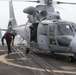 U.S. Navy Seaman Garrett Cardenas, left, from Ward, Arizona, and Boatswain’s Mate 3rd Class James Ramsdell, from Phoenix, remove chocks and chains from a Panther anti-submarine helicopter