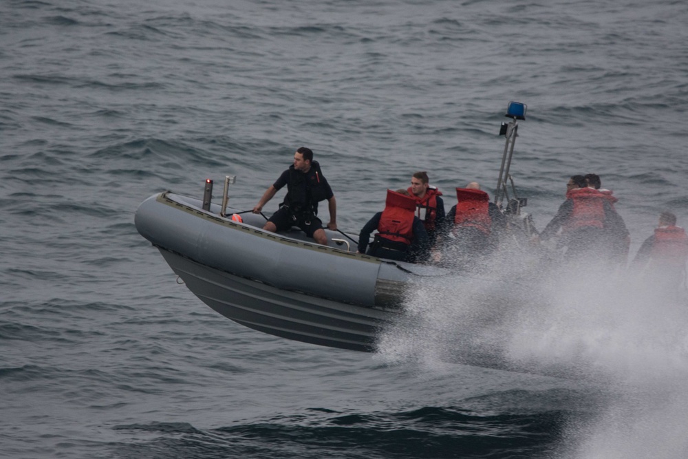 U.S. Sailors assigned to the guided-missile cruiser USS Mobile Bay (CG 53) conduct small boat operations