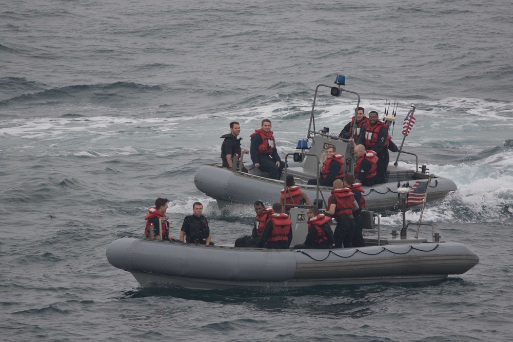 U.S. Sailors assigned to the guided-missile cruiser USS Mobile Bay (CG 53) conduct small boat operations