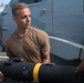 U.S. Navy Aviation Electronics Technician 2nd Class Collin Martinez, from Rutland, Massachusetts, loads an AGM-114 Hellfire missile