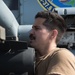 U.S. Navy Aviation Machinist’s Mate 2nd Class Frank Rivero, from Miami, loads an AGM-114 Hellfire missile