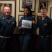 U.S. Sailor ireceives Sailor of the Day award