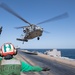 An MH-60S Seahawk lands on the flight deck of the aircraft carrier USS John C. Stennis (CVN 74)