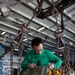 U.S. Sailors applies a new seal