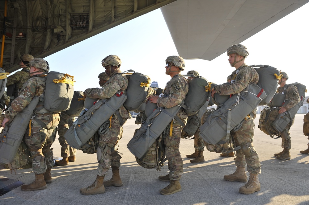 Paratroopers load aircraft before airborne operation