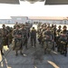 Paratroopers stand by to load aircraft.