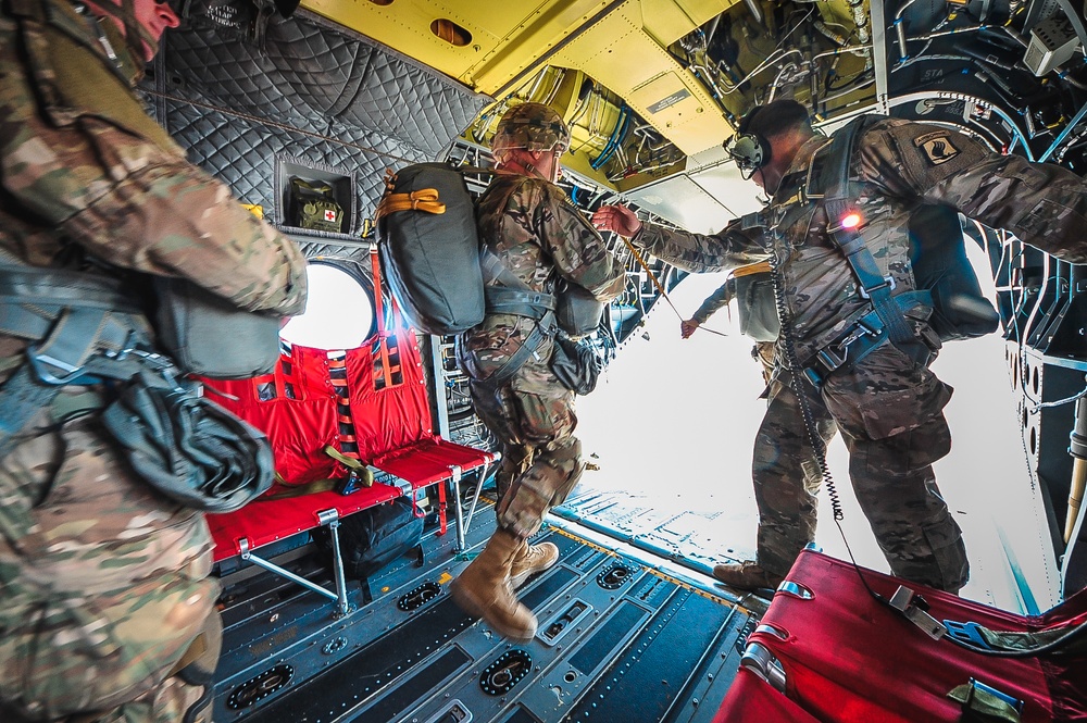 Paratroopers exit from CH-47 Chinook helicopter